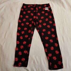 Canada Day women's size medium black leggings with maple leaf design